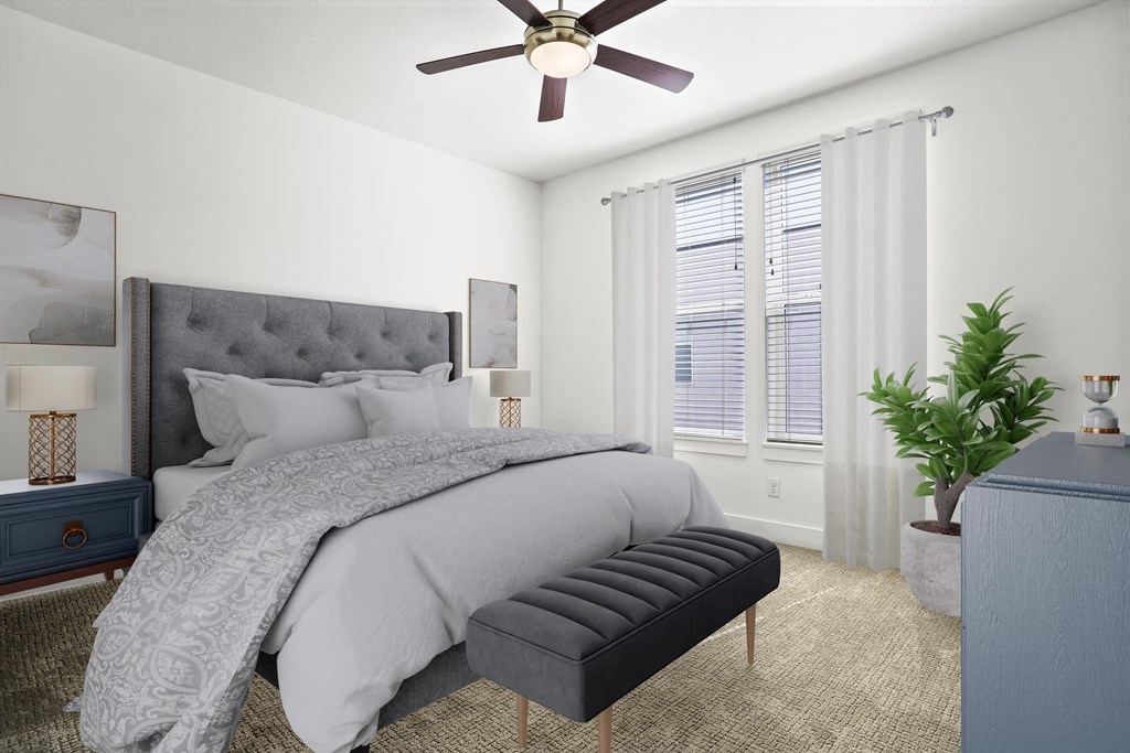 a bedroom with a bed and a ceiling fan at Aero Luxury Townhomes in Layton, Utah