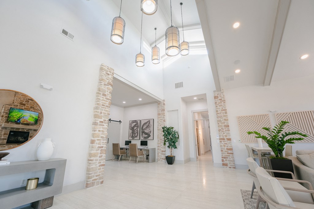 a living room and dining room with white walls and white floors at Aldara Apartments in Saratoga Springs, Utah