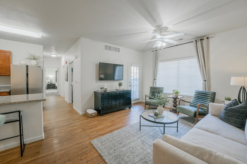 a living room with a couch and a coffee table at Aldara Apartments in Saratoga Springs, Utah