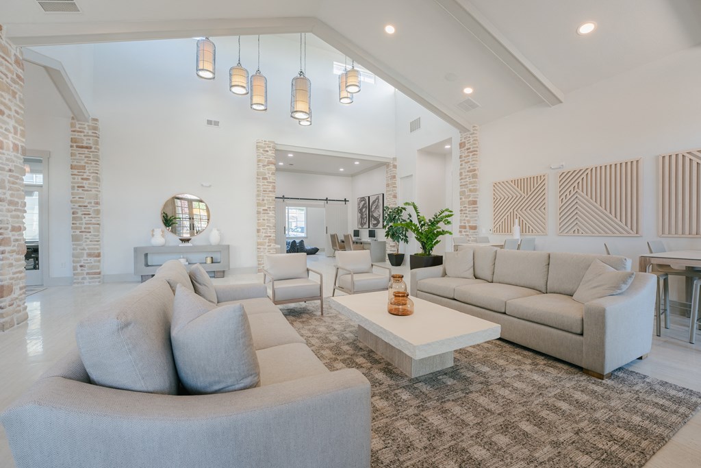 a living room with couches and chairs and a coffee table at Aldara Apartments in Saratoga Springs, Utah