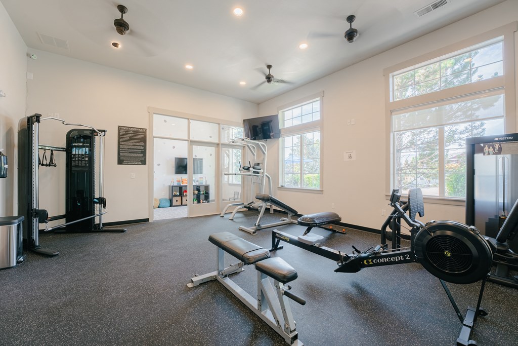 the gym with weights and cardio equipment at Aldara Apartments in Saratoga Springs, Utah