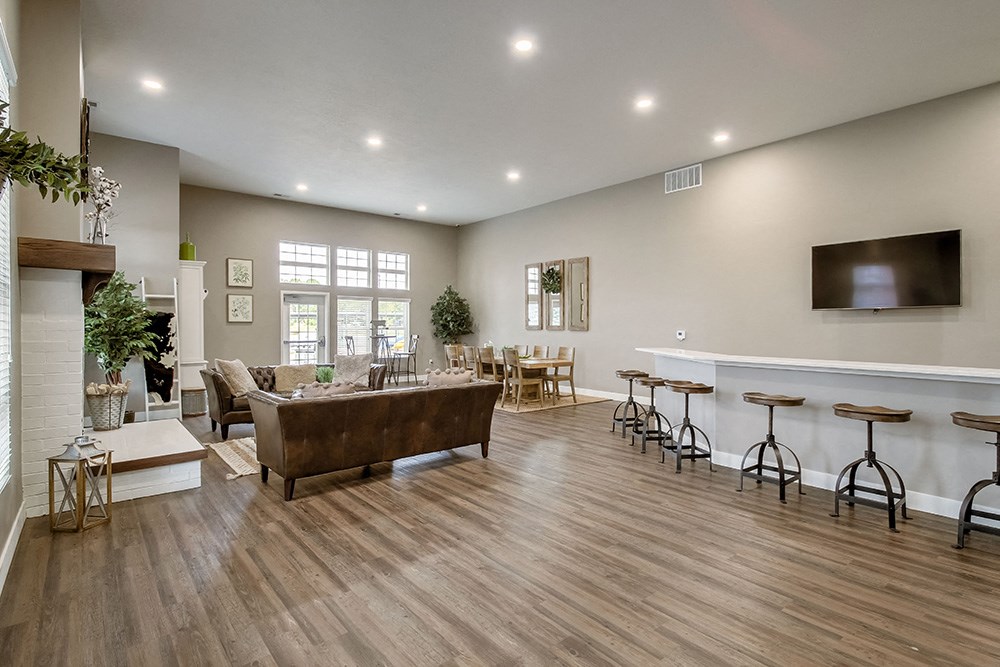 the reserve at bucklin hill clubhouse resident lounge with fireplace and tv