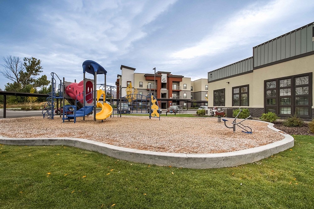 a playground at the enclave at woodbridge apartments in sugar land, tx