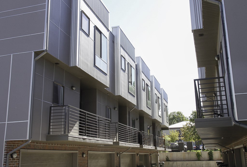 a row of modern buildings with balconies and stairs at BlueKoi Townhomes for rent in Salt Lake City, UT