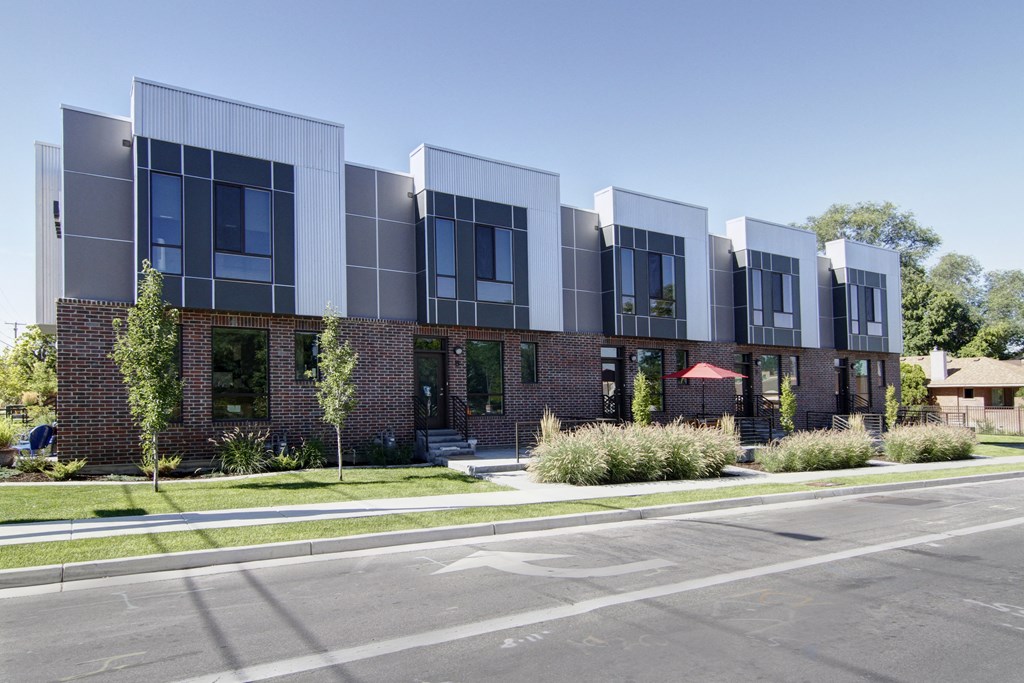 a large brick building with a street in front of it at BlueKoi Townhomes for rent in Salt Lake City, UT