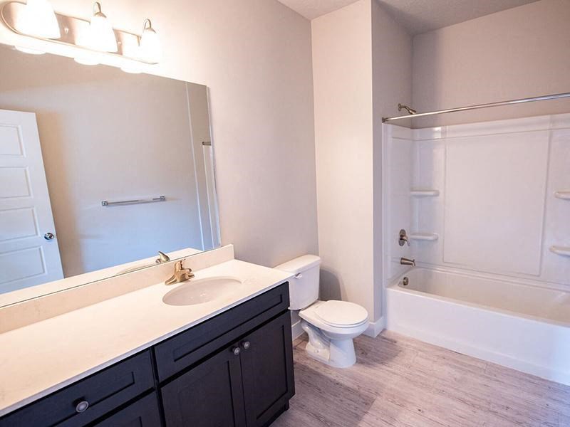 a bathroom with a sink toilet and a shower