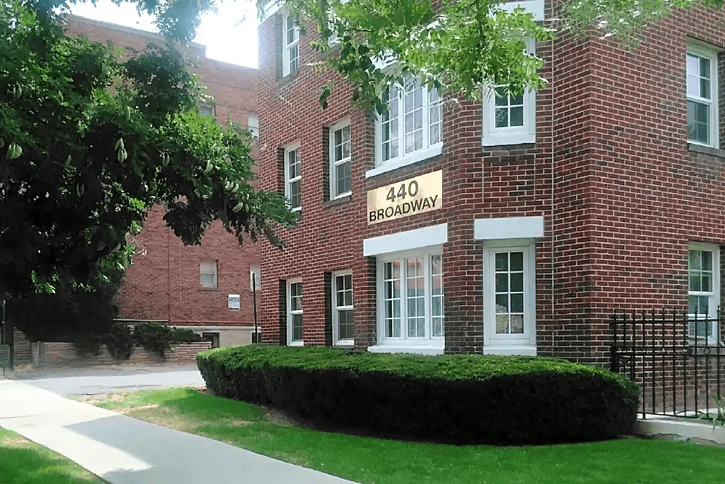 A red brick building with the number 440 Broadway on the front.
