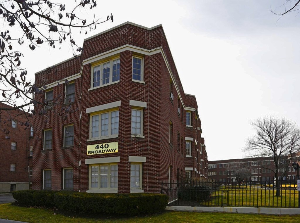 A red brick building with the number 440 on it.