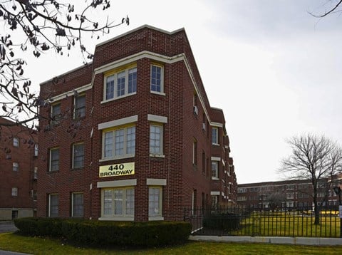 A red brick building with the number 440 on it.