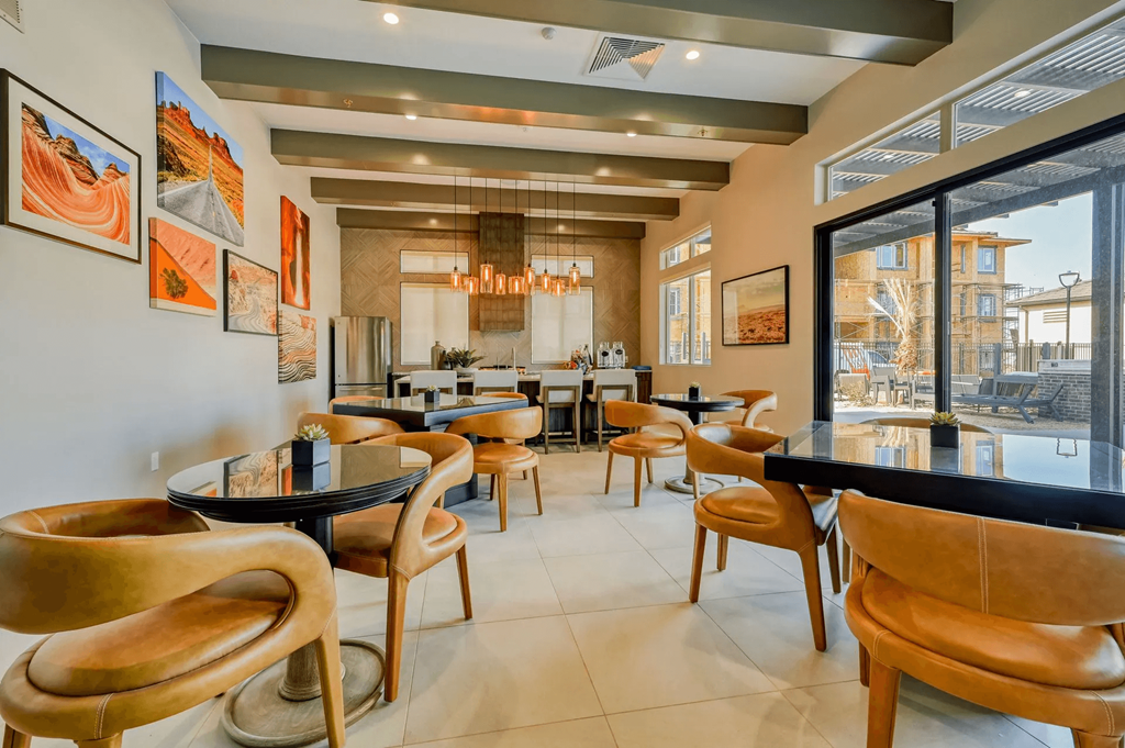 a restaurant with tables and chairs and a large window
