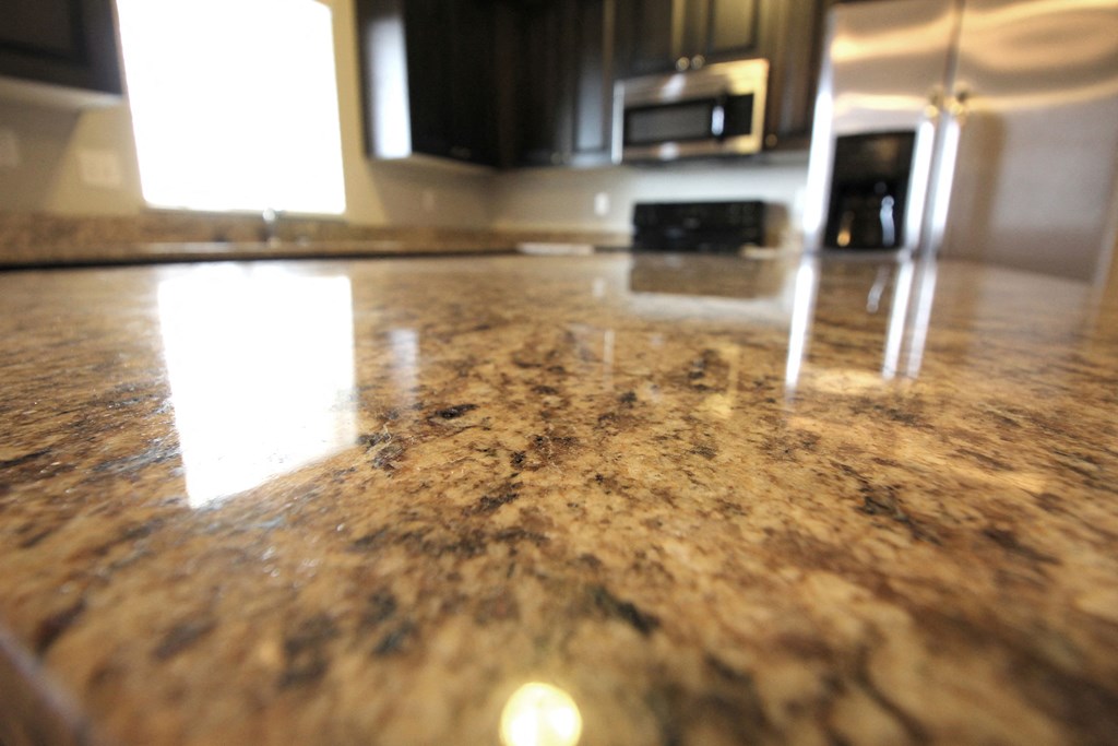 a closeup of a granite countertop in a kitchen