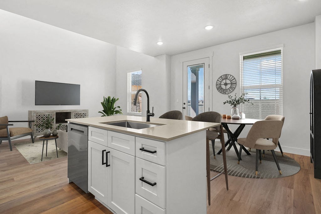 kitchen island and dining area at Crestview at Highland townhomes in Highland, UT