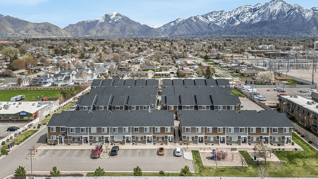 A large building with a parking lot in front of it.