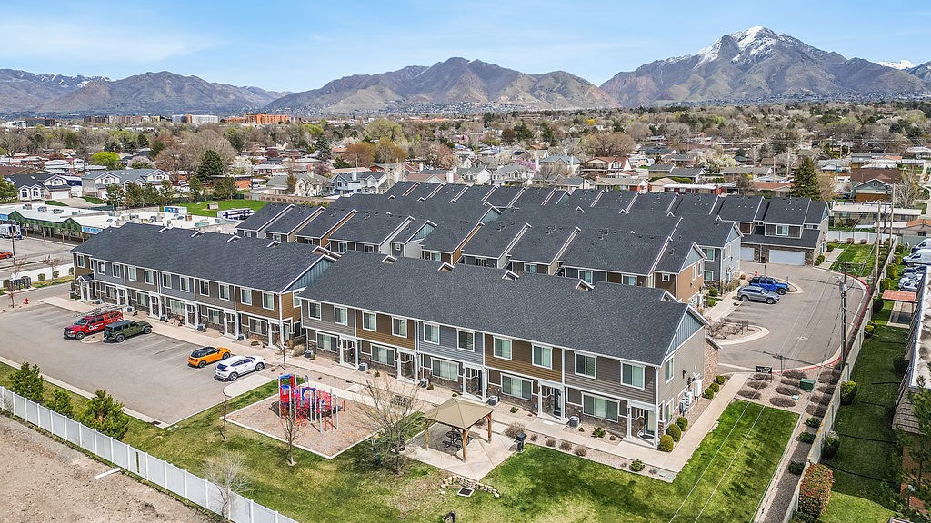 A large building with a parking lot in front of it.