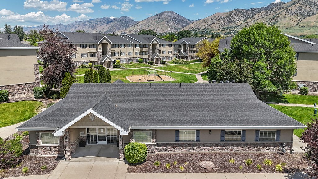 A house with a mountain view in the background.