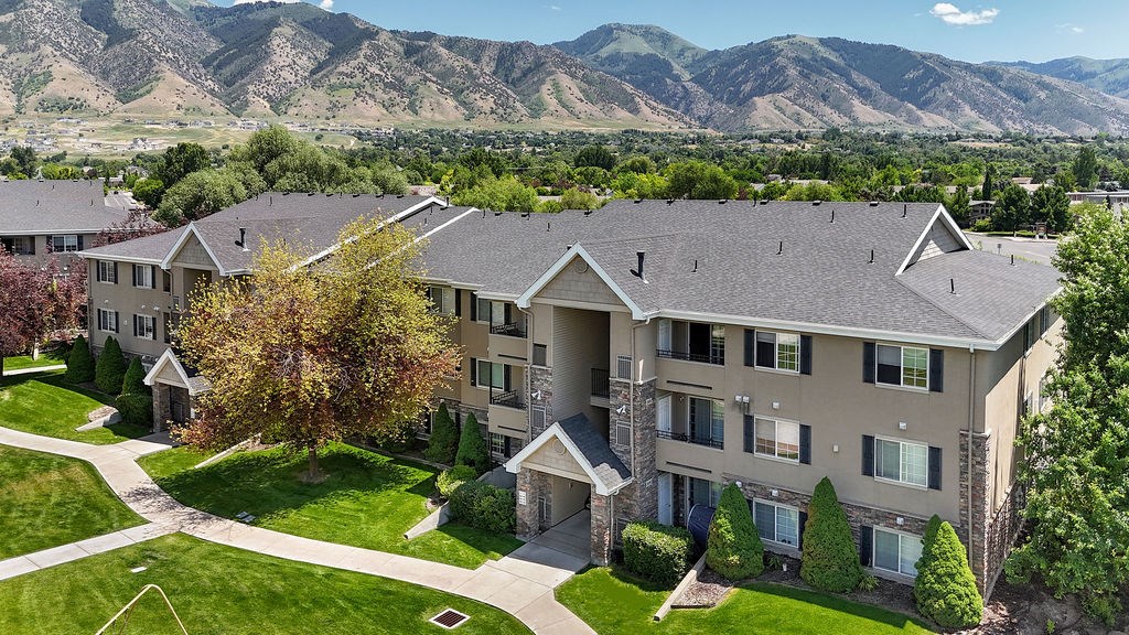 Apartment complex with a mountain range in the background.