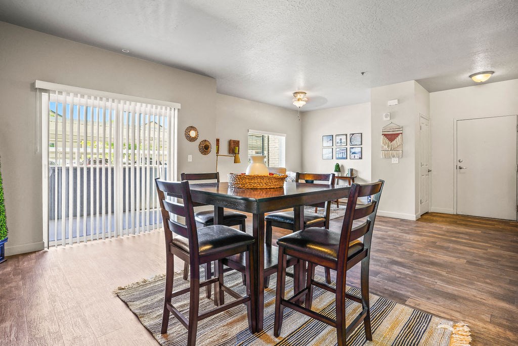 a dining room with a table and chairs