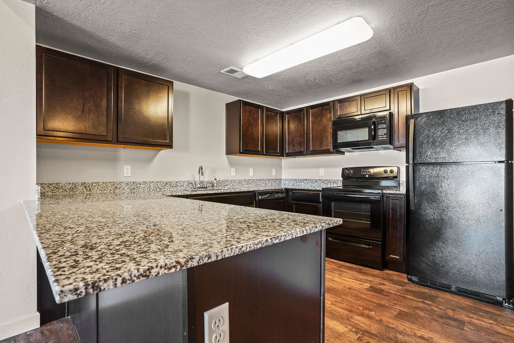 a kitchen with a granite counter top and
