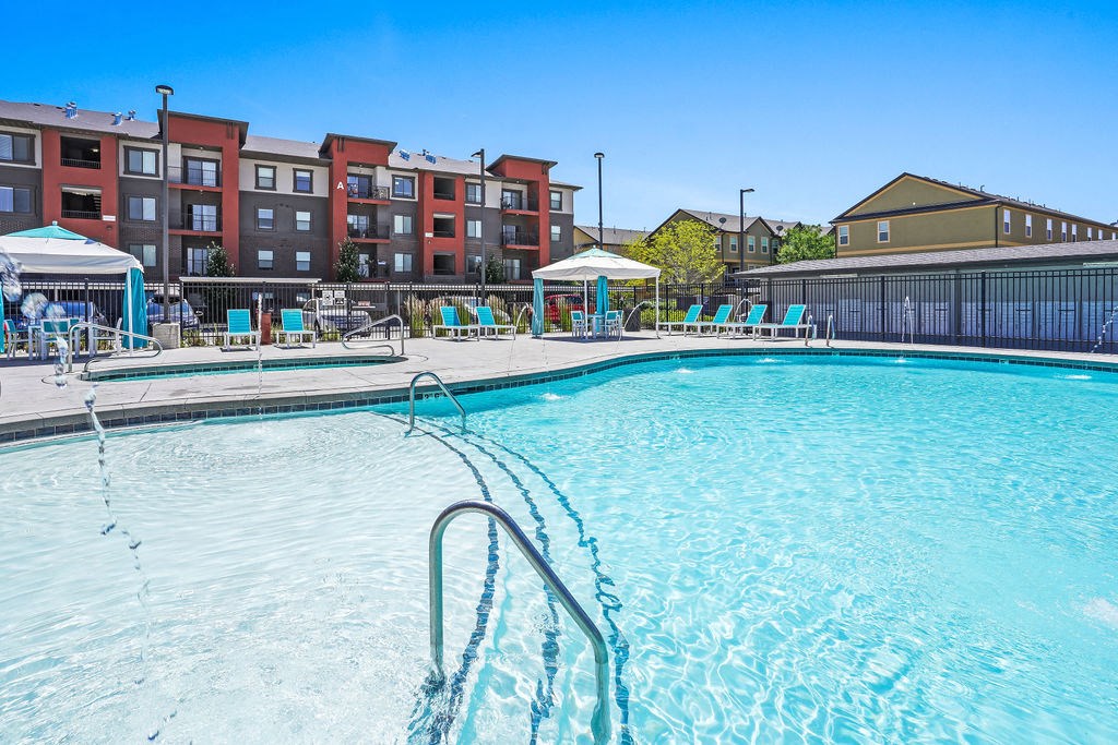 our apartments have a resort style pool with chaise lounge chairs