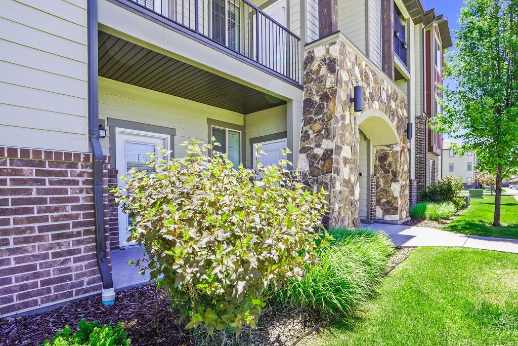 A building with a stone pillar and a window.