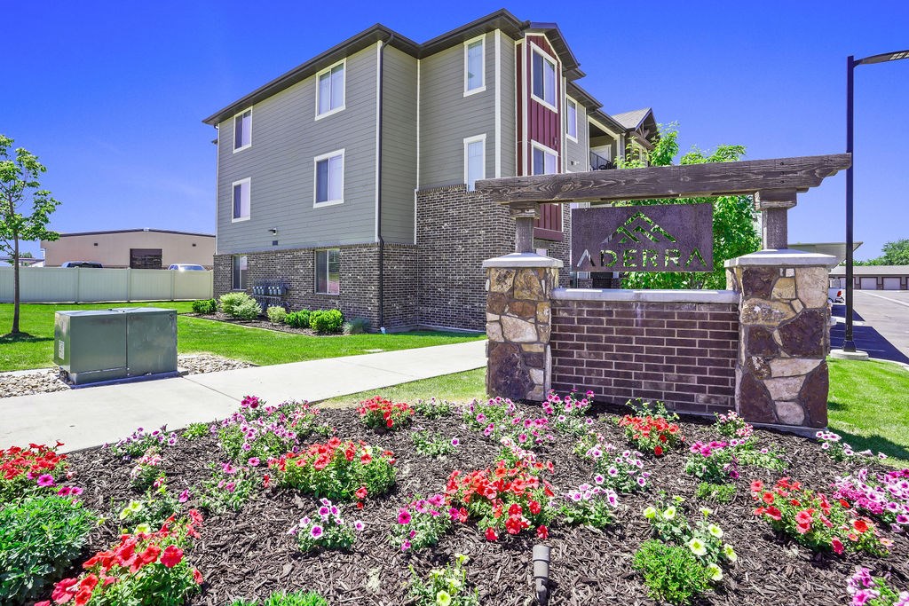 A building with a garden in front of it.