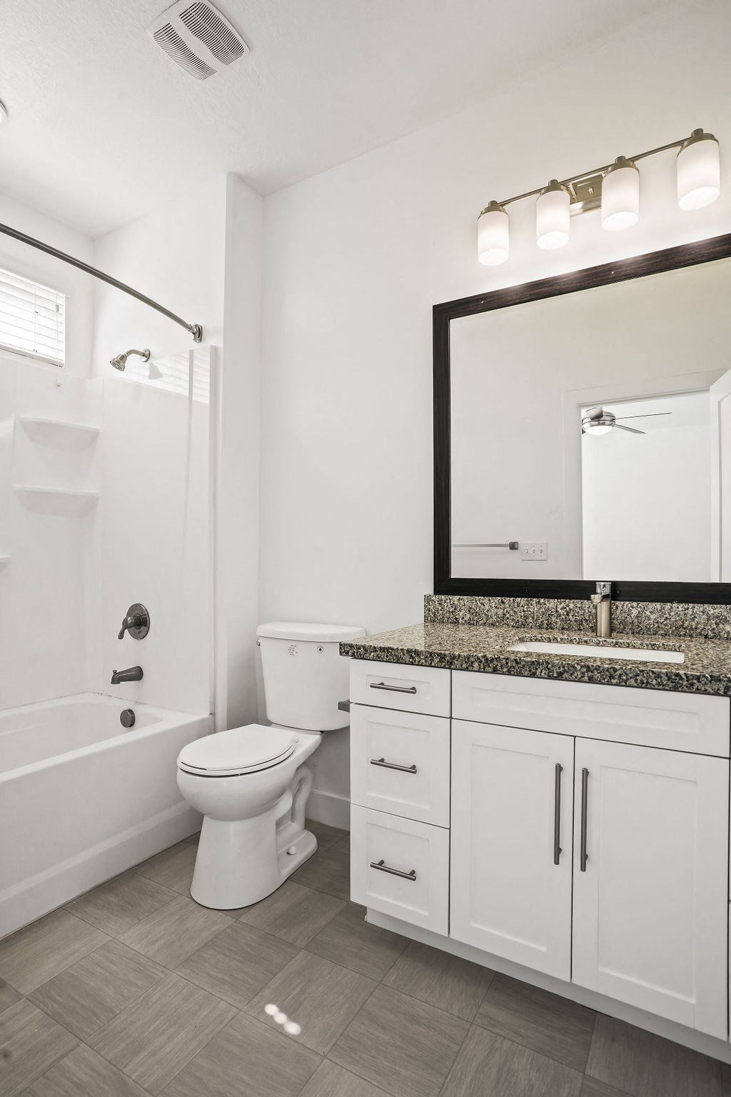 a bathroom with a toilet and a sink and a bath tub  at Aero Luxury Townhomes in Layton, Utah