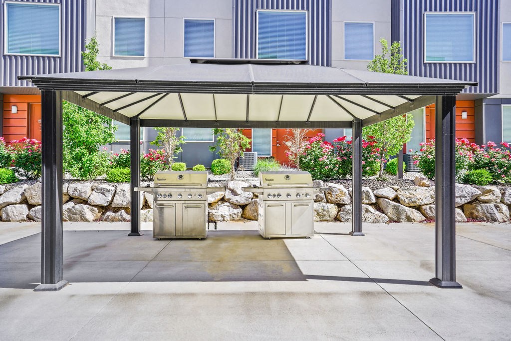 a covered barbecue area with two bbq grills  at Aero Luxury Townhomes in Layton, Utah