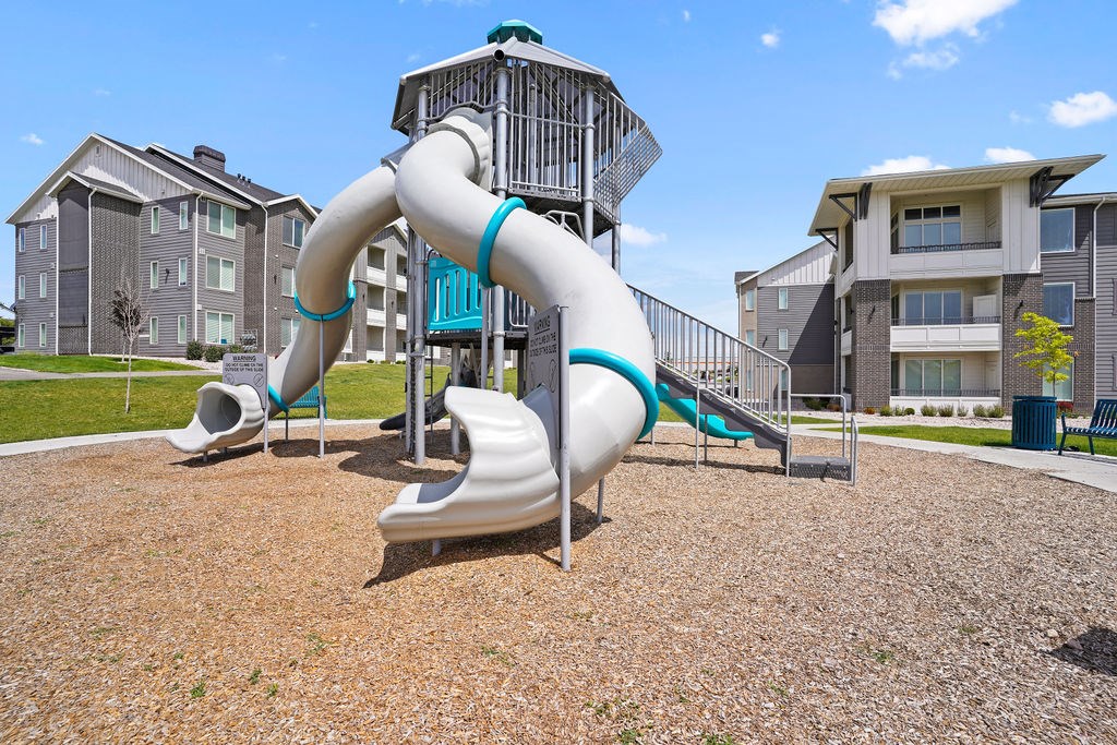 Affinity 56 Apartments for rent in West Jordan, UT  A playground with a slide and a play structure.