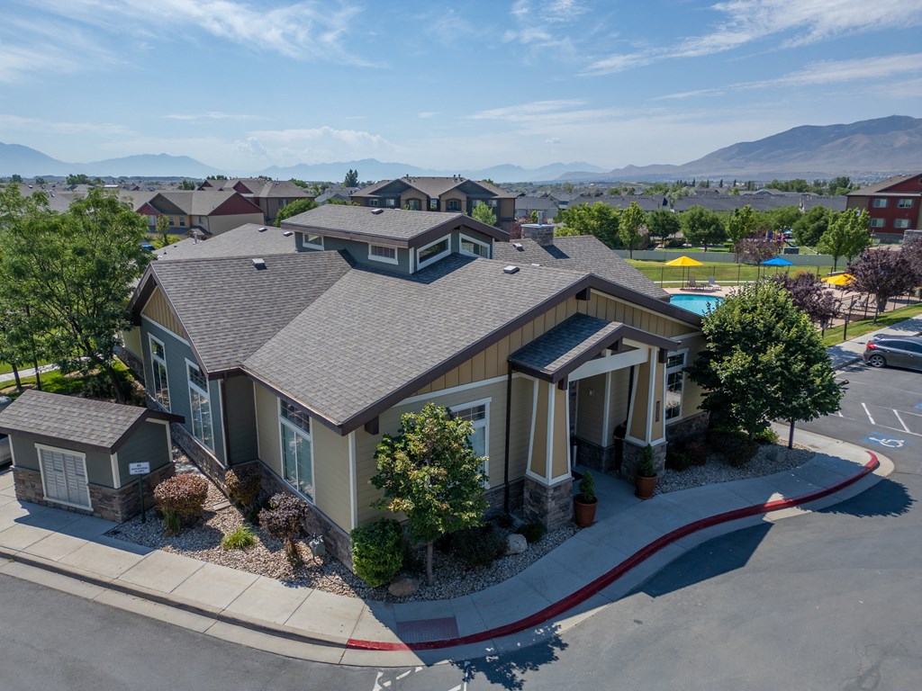 an aerial view of a home in a neighborhood with a swimming pool at Aldara Apartments in Saratoga Springs, Utah