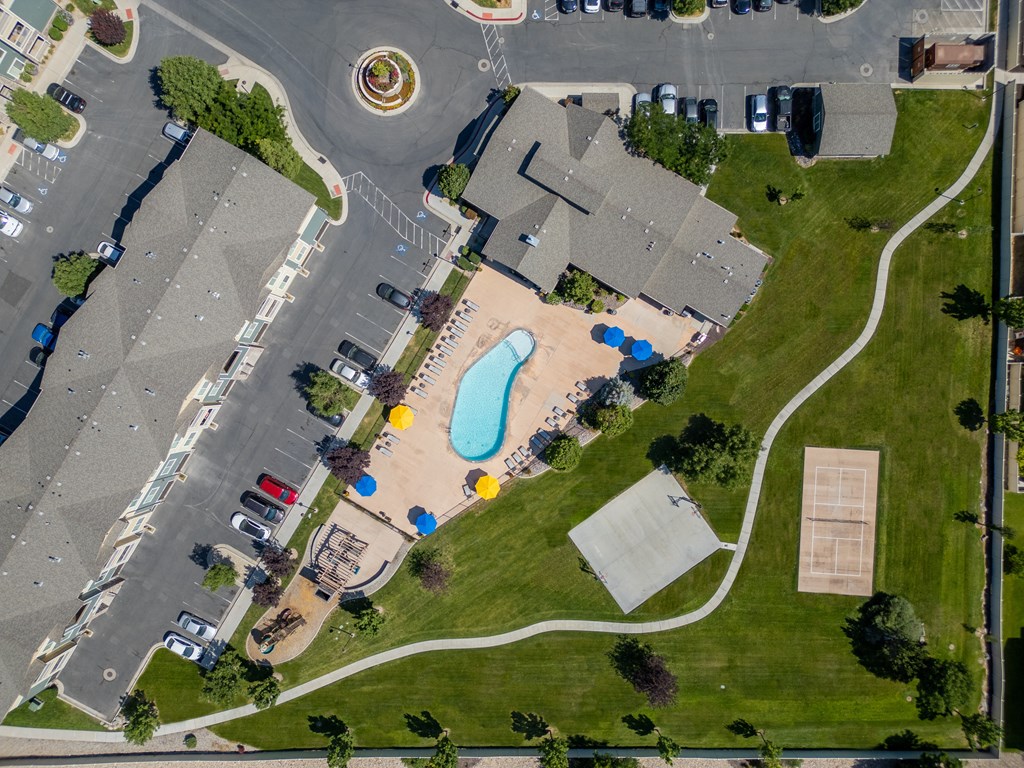 an aerial view of a neighborhood with a swimming pool in the middle of a street at Aldara Apartments in Saratoga Springs, Utah