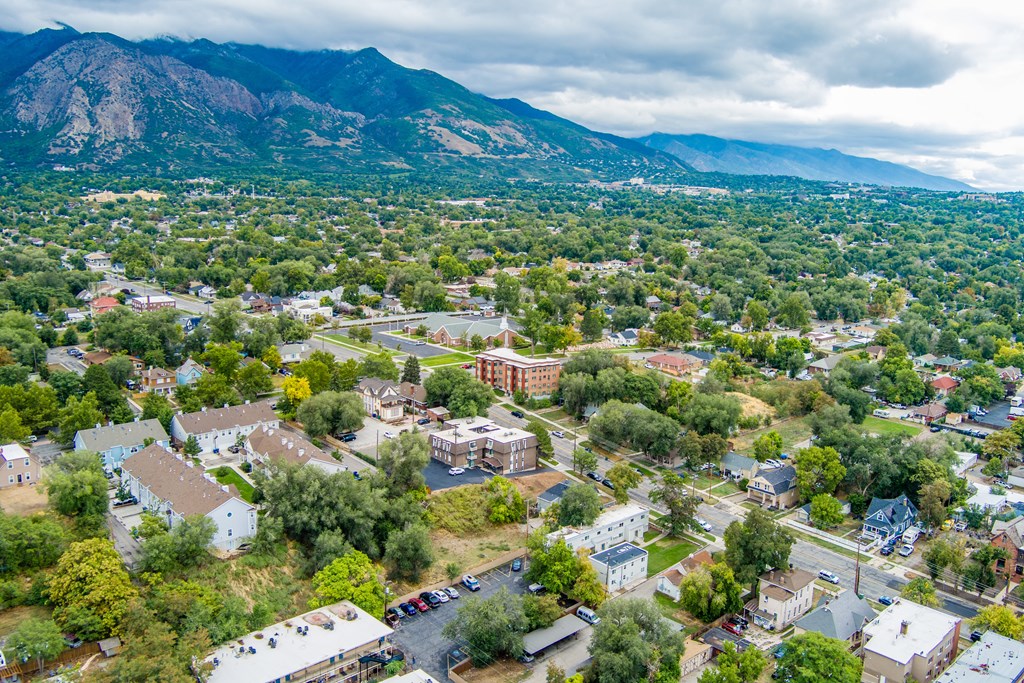 A small town with a mountain in the background.