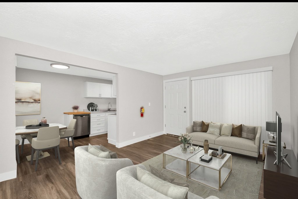 A living room with a couch, chairs, and a coffee table.