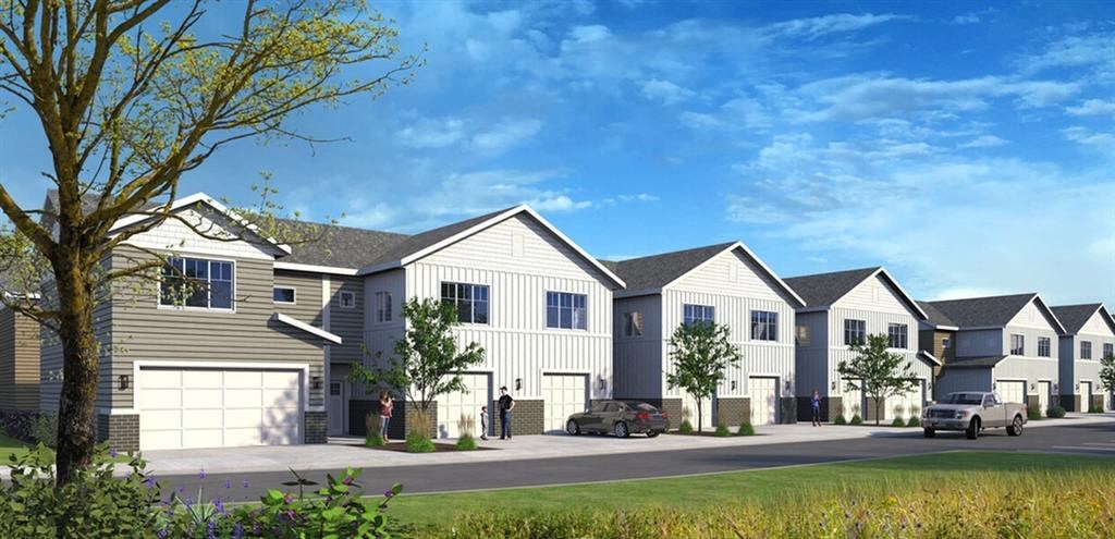 a row of houses with cars parked in front of them