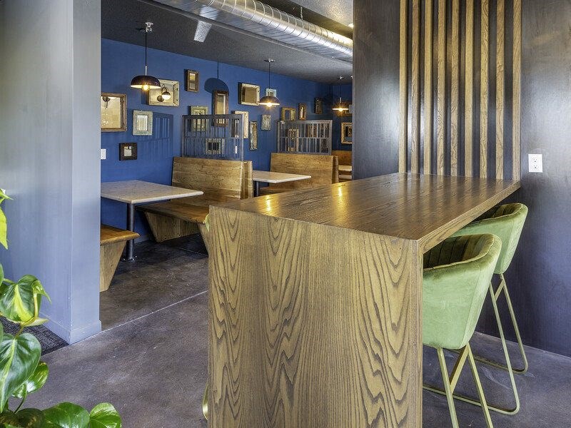 a restaurant with a wooden table and chairs