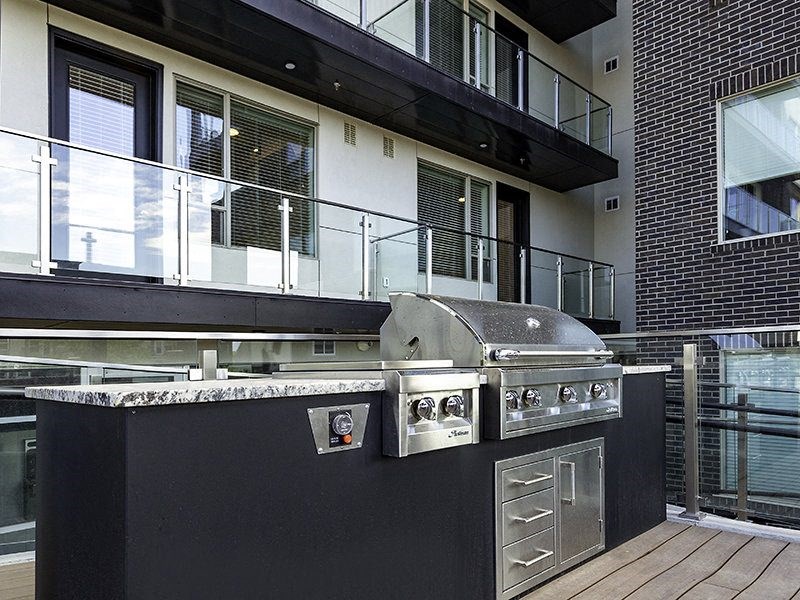a barbecue grill in the middle of a patio