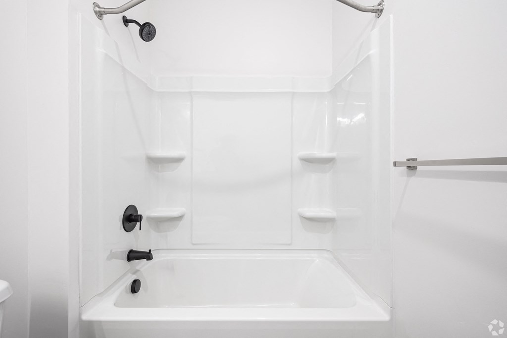 a white bathroom with a tub and a shower at Lotus Gallacher luxury apartments for rent in Salt Lake City, UT