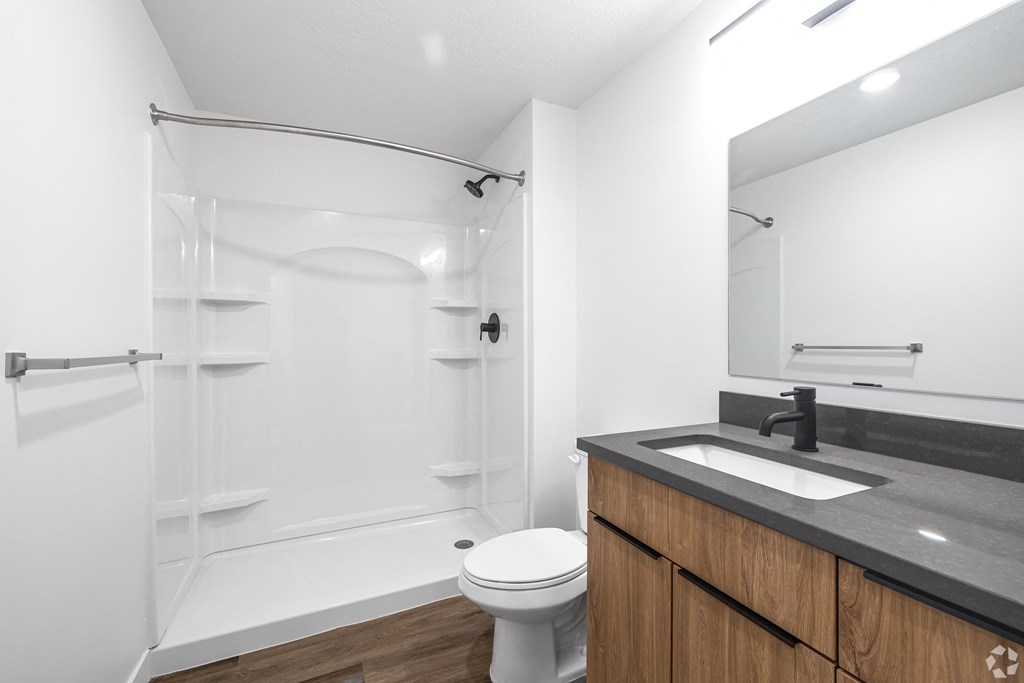 a bathroom with a sink toilet and shower at Lotus Gallacher luxury apartments for rent in Salt Lake City, UT