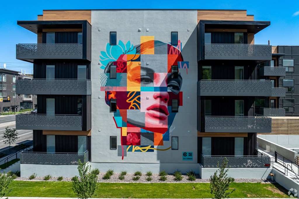 a mural of a face on the side of a building at Lotus Gallacher luxury apartments for rent in Salt Lake City, UT