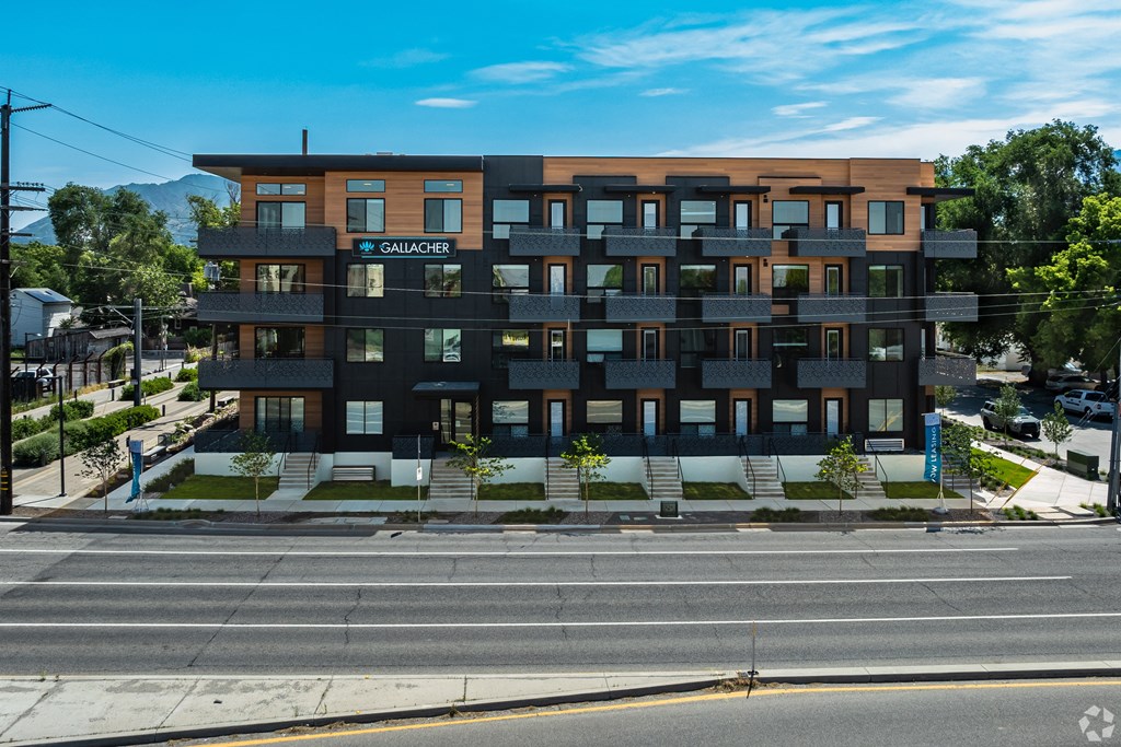a large apartment building on the side of a street at Lotus Gallacher luxury apartments for rent in Salt Lake City, UT