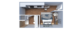 A modern living room with a grey couch and a grey and white patterned throw.