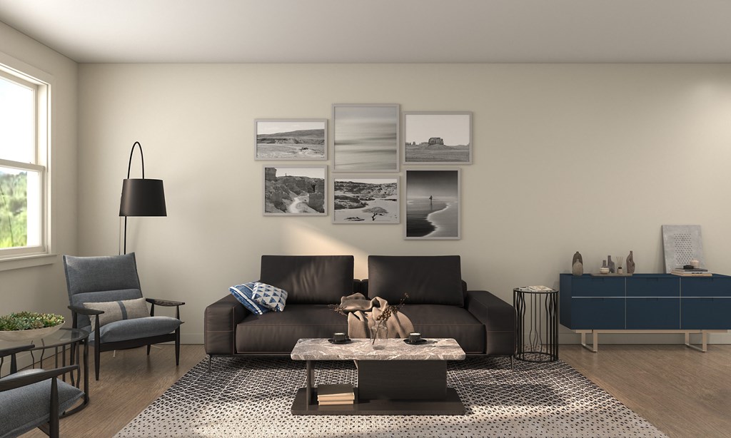 A living room with a brown couch, a coffee table, and a lamp.