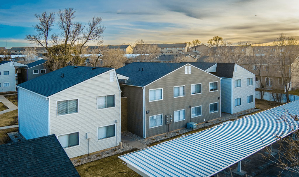 A row of houses with a metal roof.