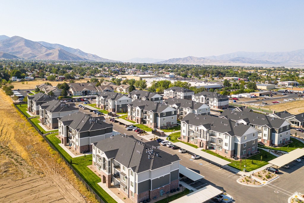 A row of houses with a mountain in the background.