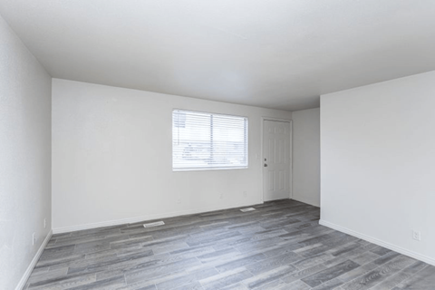 A room with a window and a door.