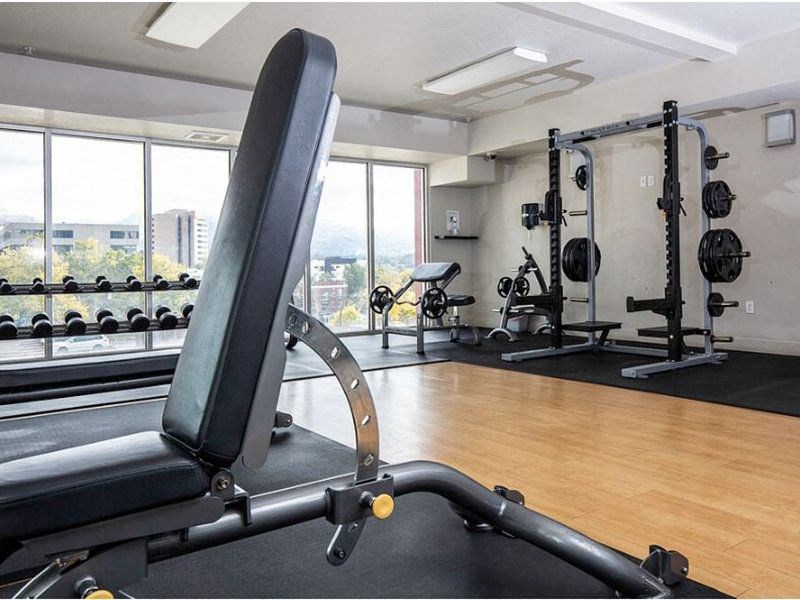 a gym with a squat rack at The Lotus Apartments for rent in Downtown Salt Lake City, Utah