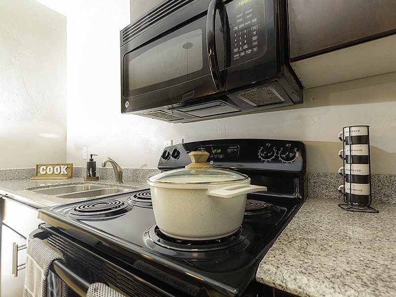 a kitchen stove and microwave from The Lotus Apartments in Downtown Salt Lake City, Utah