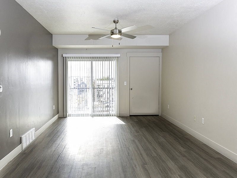 interior photo of a living room with a large window from The Lotus Apartments in Downtown Salt Lake City, Utah