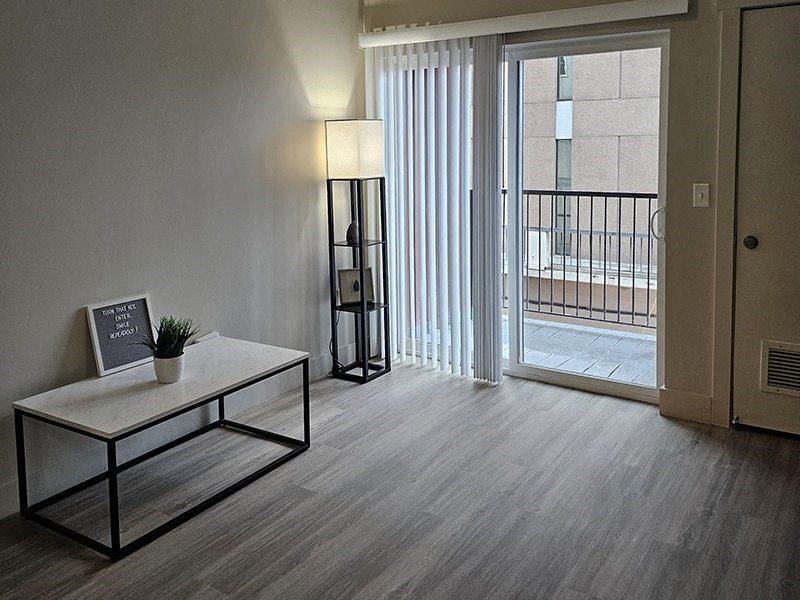 interior photo of a living area with a sliding glass door from The Lotus Apartments in Downtown Salt Lake City, Utah