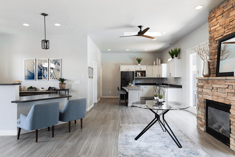 A modern kitchen with a dining table and chairs.