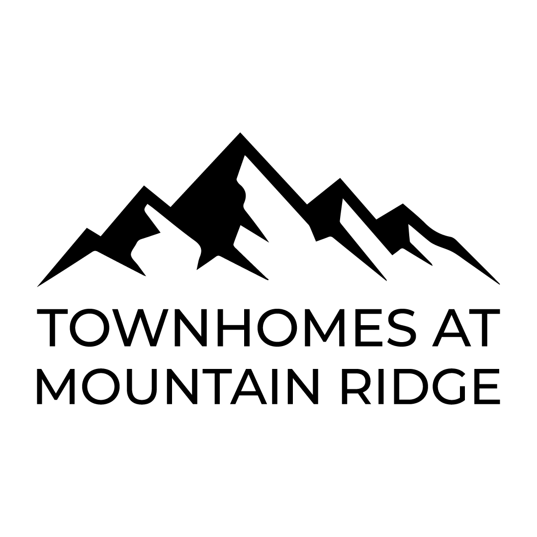 A black and white image of a mountain range with the text "Townhomes at Mountain Ridge" below it.